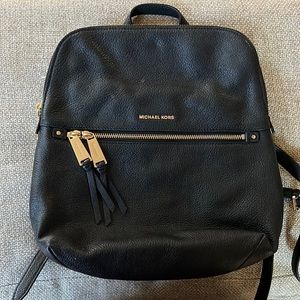 Black Michael Kors Backpack w/ Gold Accents.